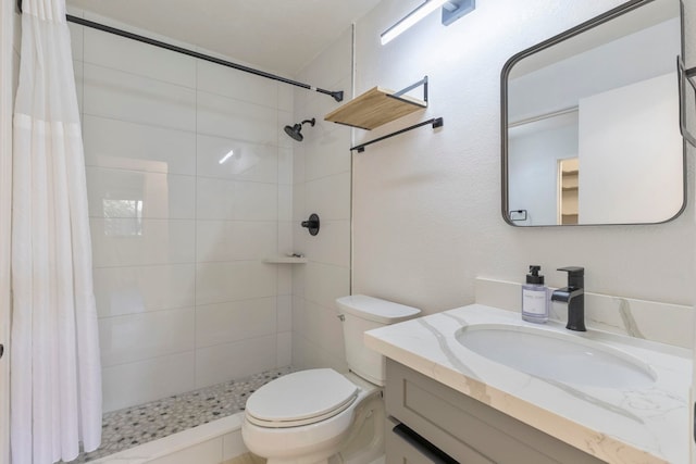 480 Kenolio Rd Unit 24-202, Kihei, HI 96753 - bathroom featuring vanity, toilet, and a tile shower