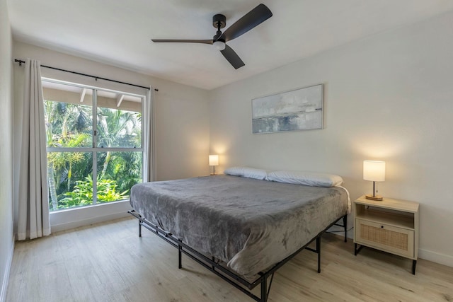 480 Kenolio Rd Unit 24-202, Kihei, HI 96753 - bedroom featuring wood finished floors, baseboards, and ceiling fan