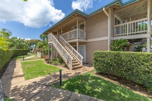 480 Kenolio Rd Unit 24-202, Kihei, HI 96753 - rear view of house with stairway