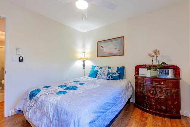 bedroom with ceiling fan and hardwood / wood-style floors