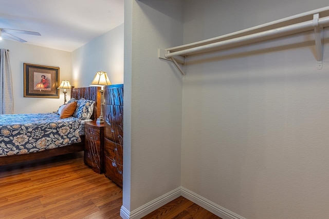 bedroom featuring wood-type flooring and ceiling fan