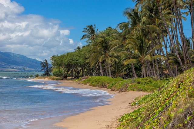 property view of water featuring a mountain view and a beach view