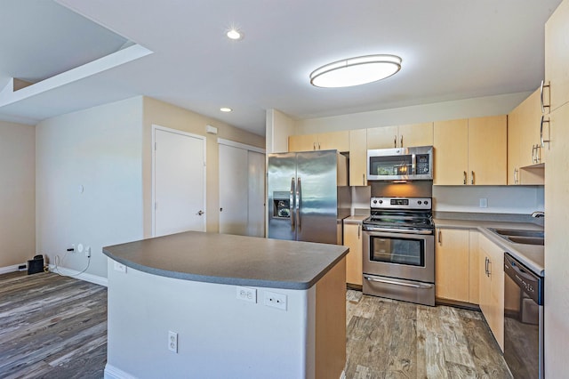 10 Polohina Ln Unit 2-3, Lahaina, HI 96761 - kitchen featuring appliances with stainless steel finishes, light brown cabinets, a sink, wood finished floors, and dark countertops
