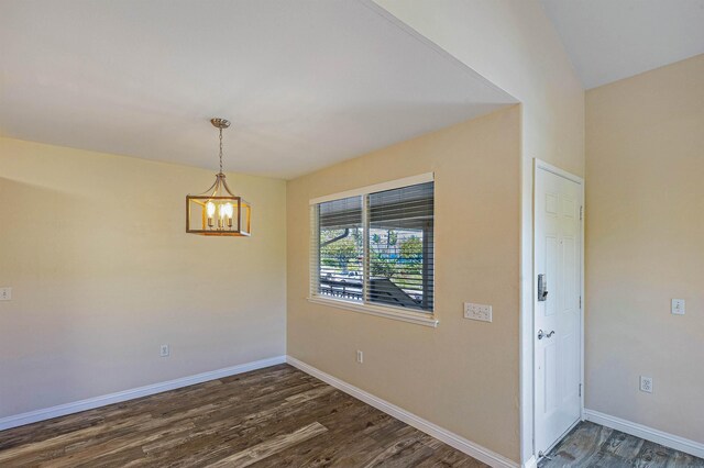 10 Polohina Ln Unit 2-3, Lahaina, HI 96761 - spare room with dark wood-style floors, a chandelier, and baseboards