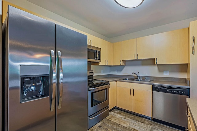 10 Polohina Ln Unit 2-3, Lahaina, HI 96761 - kitchen featuring appliances with stainless steel finishes, a sink, light brown cabinetry, and dark wood finished floors
