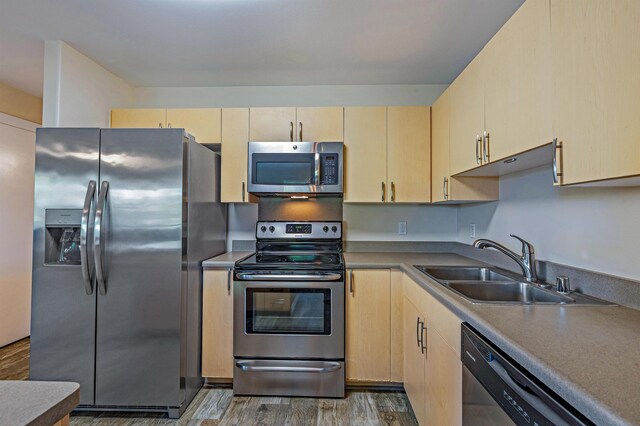 10 Polohina Ln Unit 2-3, Lahaina, HI 96761 - kitchen with stainless steel appliances, light brown cabinetry, a sink, and wood finished floors