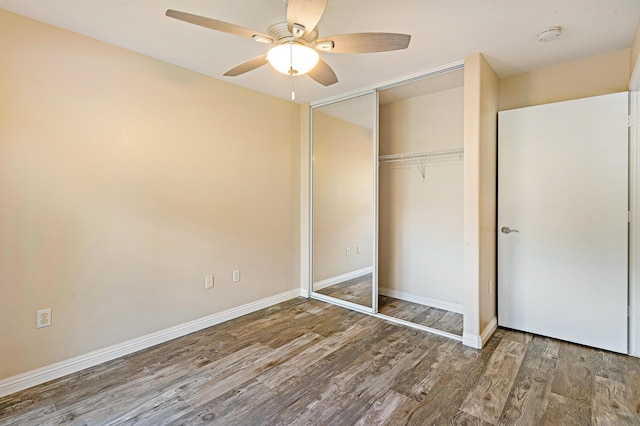 10 Polohina Ln Unit 2-3, Lahaina, HI 96761 - unfurnished bedroom with wood finished floors, a closet, baseboards, and a ceiling fan