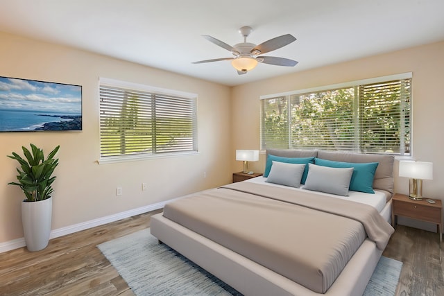 10 Polohina Ln Unit 2-3, Lahaina, HI 96761 - bedroom with wood finished floors, baseboards, and a ceiling fan