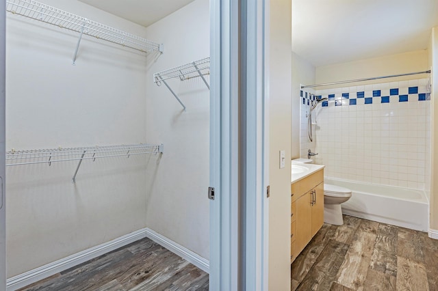 10 Polohina Ln Unit 2-3, Lahaina, HI 96761 - full bath with wood finished floors, vanity, toilet, shower / bath combination, and baseboards