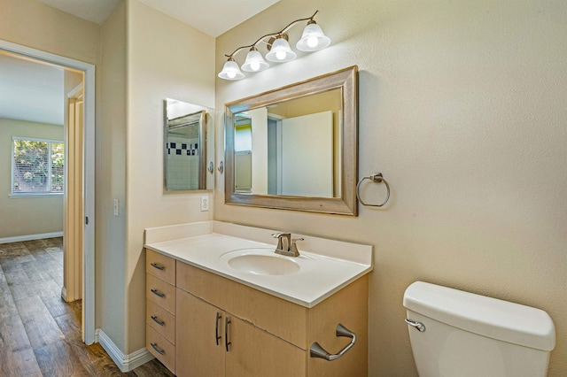 10 Polohina Ln Unit 2-3, Lahaina, HI 96761 - bathroom with wood finished floors, baseboards, vanity, and toilet