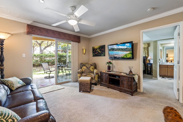 carpeted living room featuring ceiling fan and ornamental molding