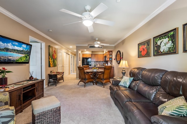 carpeted living room with crown molding and ceiling fan