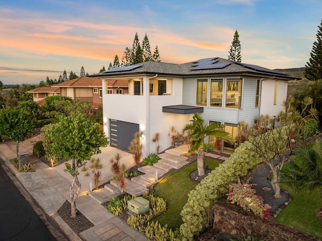 92 Kahana Ridge Dr, Lahaina, HI 96761 - view of front of home with concrete driveway, an attached garage, and solar panels