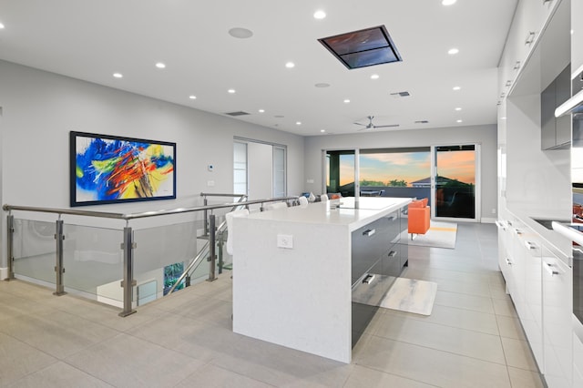 92 Kahana Ridge Dr, Lahaina, HI 96761 - kitchen with modern cabinets, a kitchen island, white cabinets, light countertops, and recessed lighting