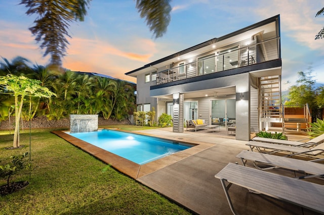 92 Kahana Ridge Dr, Lahaina, HI 96761 - back of house featuring a balcony, an outdoor living space, a patio, an outdoor pool, and a yard