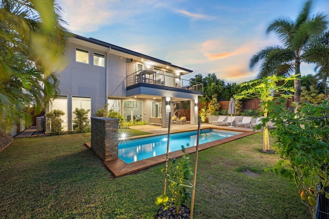 92 Kahana Ridge Dr, Lahaina, HI 96761 - back of property at dusk with a balcony and a patio