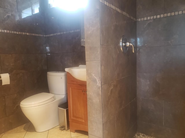 215 Aahi Pl, Kaunakakai, HI 96748 - bathroom featuring tile walls, toilet, a tile shower, vanity, and tile patterned flooring