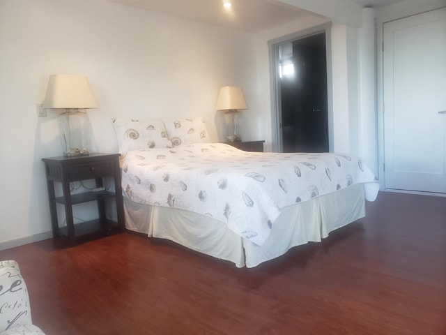 215 Aahi Pl, Kaunakakai, HI 96748 - bedroom with dark wood-style floors and baseboards
