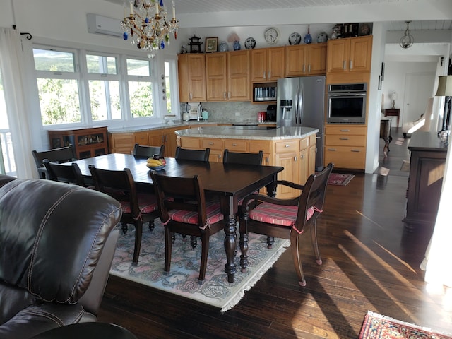 215 Aahi Pl, Kaunakakai, HI 96748 - dining space featuring dark wood-style flooring, a chandelier, and a wall unit AC