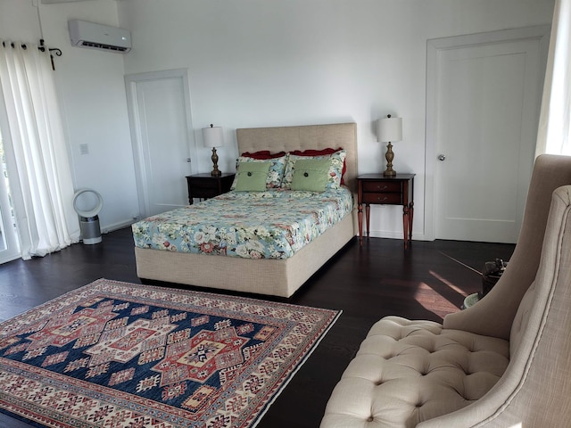 215 Aahi Pl, Kaunakakai, HI 96748 - bedroom with a wall mounted AC, wood finished floors, and baseboards