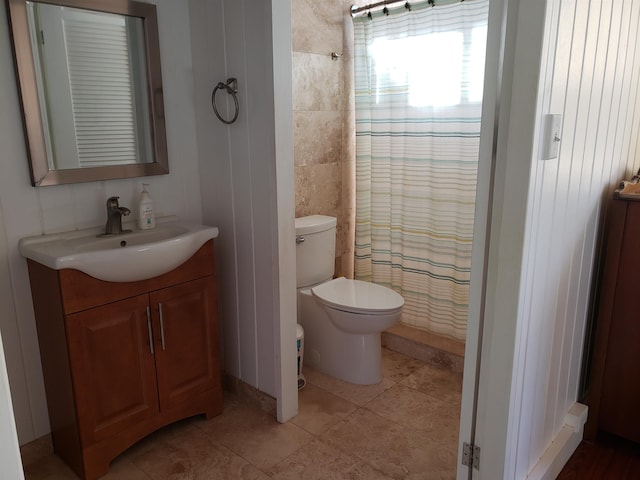 215 Aahi Pl, Kaunakakai, HI 96748 - full bath featuring vanity, toilet, a shower with curtain, tile walls, and tile patterned flooring