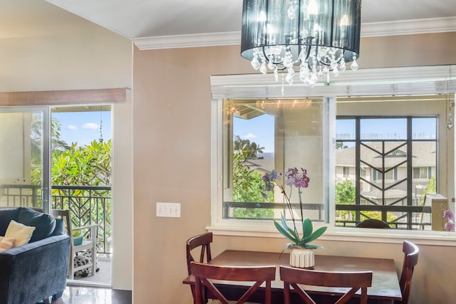 dining space with ornamental molding and plenty of natural light