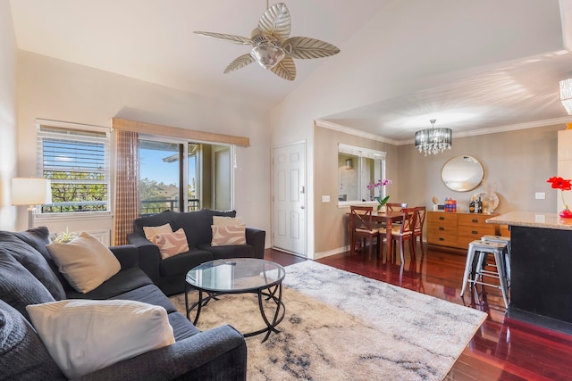 living room with ceiling fan with notable chandelier, vaulted ceiling, ornamental molding, and dark hardwood / wood-style floors