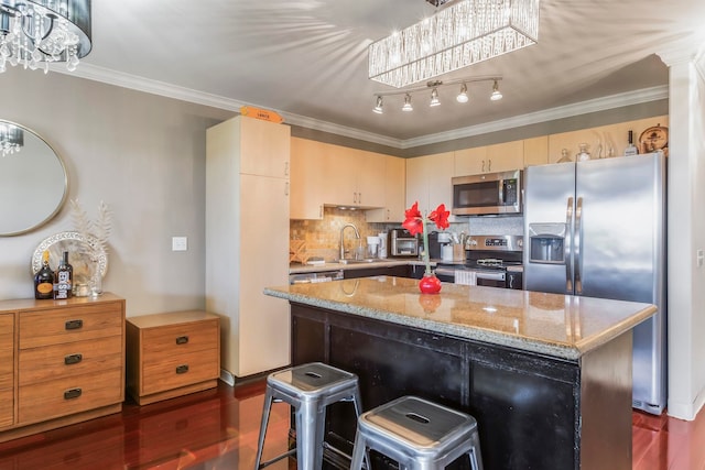 kitchen with crown molding, a center island, dark hardwood / wood-style floors, stainless steel appliances, and decorative backsplash