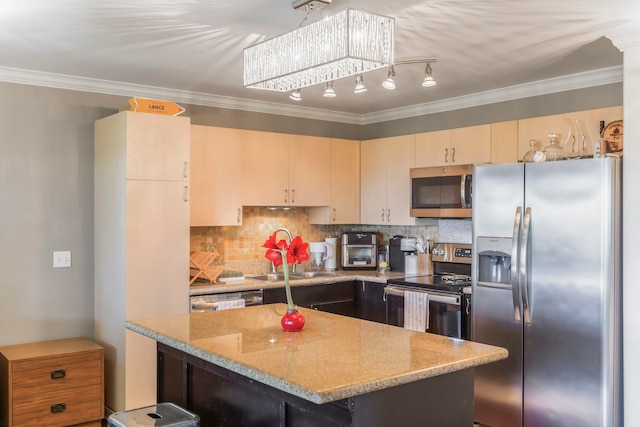 kitchen featuring sink, tasteful backsplash, a kitchen island, stainless steel appliances, and light stone countertops