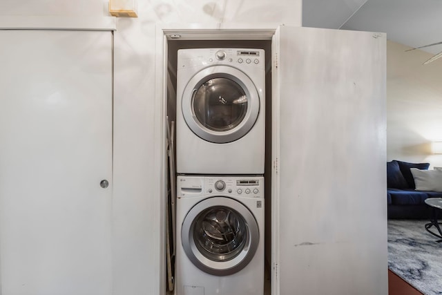 washroom with stacked washer / drying machine