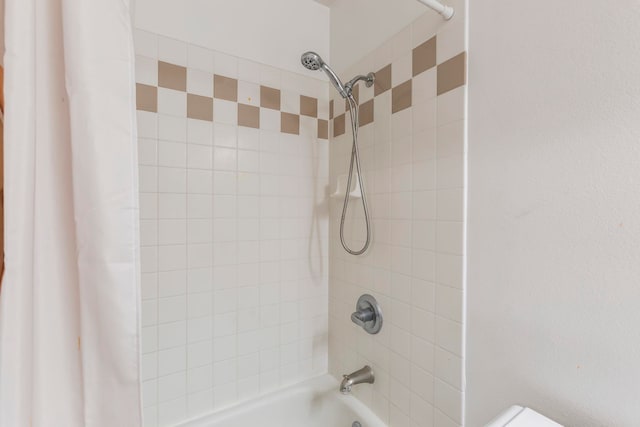 bathroom with shower / bath combination with curtain