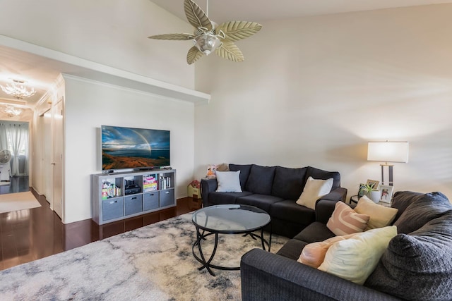 living room with ceiling fan and dark hardwood / wood-style flooring