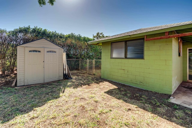 293 Manini Pl, Kihei, HI 96753 - view of yard featuring a storage unit, an outdoor structure, and fence