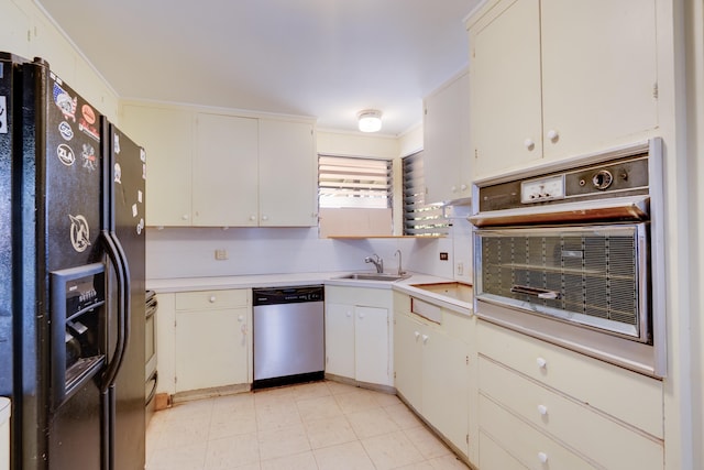 293 Manini Pl, Kihei, HI 96753 - kitchen featuring oven, black fridge, a sink, stainless steel dishwasher, and light countertops