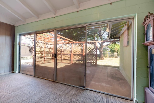 293 Manini Pl, Kihei, HI 96753 - entryway with lofted ceiling with beams, carpet, and concrete block wall