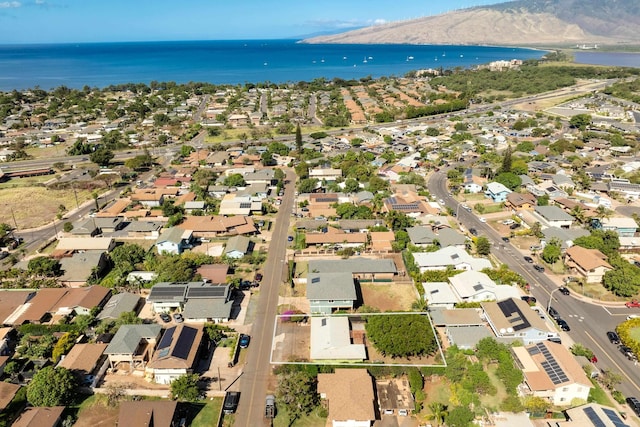 drone / aerial view with a residential view and a water view