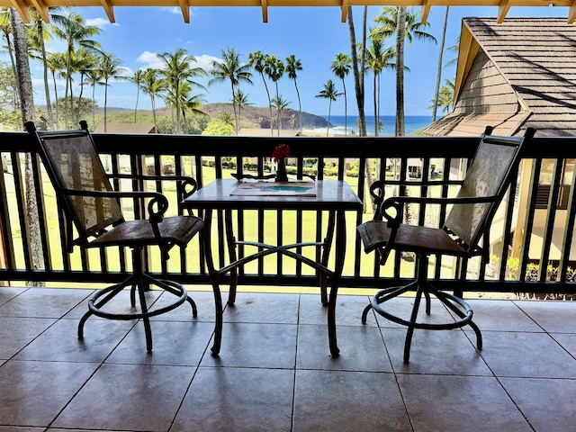 balcony featuring a water view