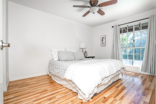 bedroom featuring hardwood / wood-style flooring and ceiling fan