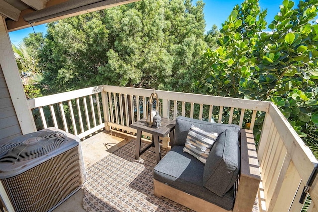 wooden deck featuring central AC unit