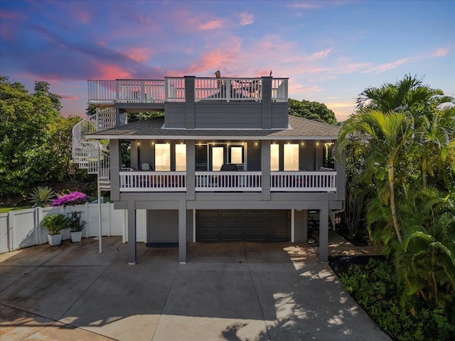 view of front of house with a balcony and a garage