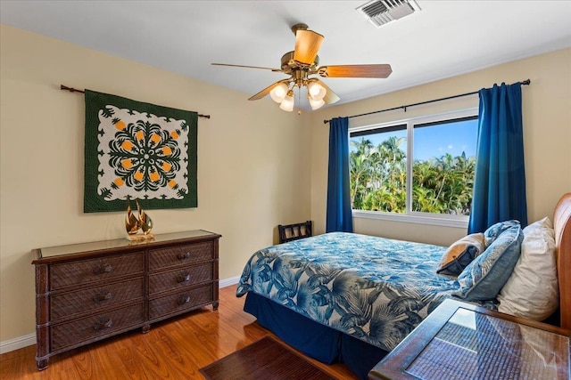 bedroom featuring hardwood / wood-style floors and ceiling fan