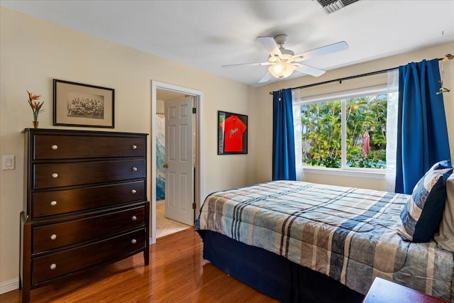 bedroom featuring ceiling fan and wood-type flooring