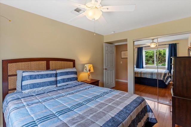 bedroom featuring ceiling fan, hardwood / wood-style floors, and a closet