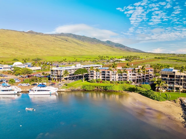 bird's eye view with a water and mountain view