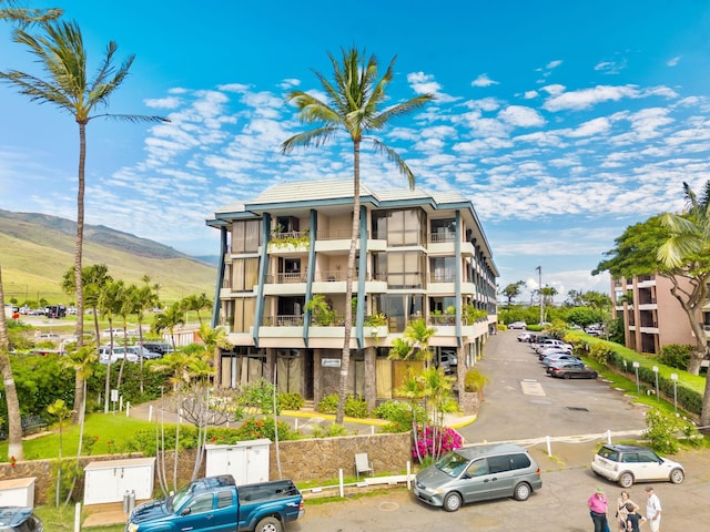 view of building exterior featuring a mountain view