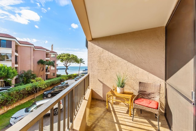 balcony featuring a water view