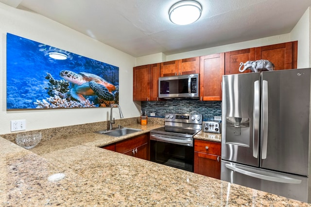 kitchen featuring a sink, stainless steel appliances, and tasteful backsplash