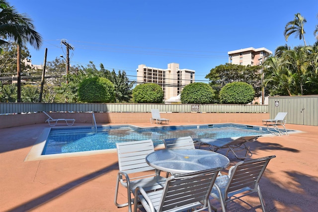 pool featuring a patio area