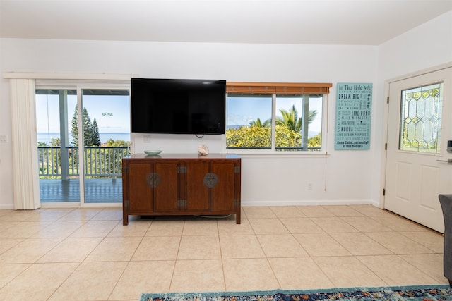 unfurnished living room with light tile floors