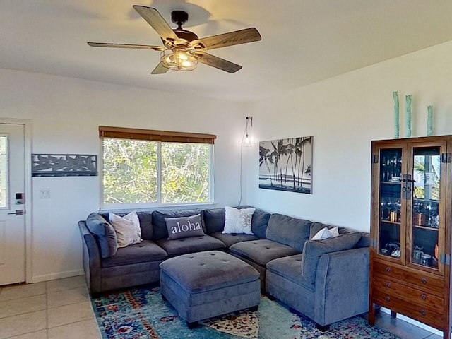 living room with ceiling fan and light tile flooring